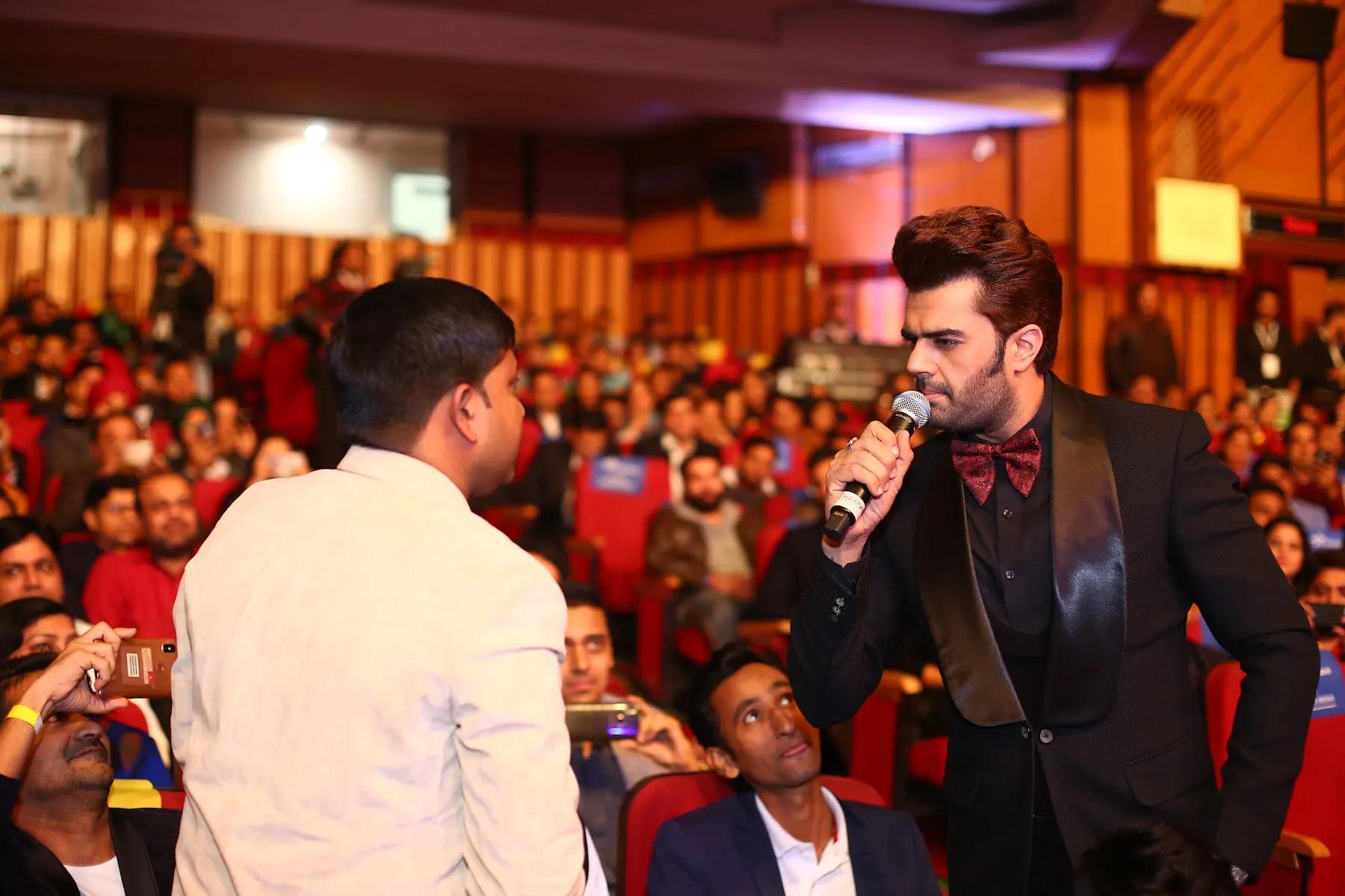 Host performing among the audience at the Flipkart event