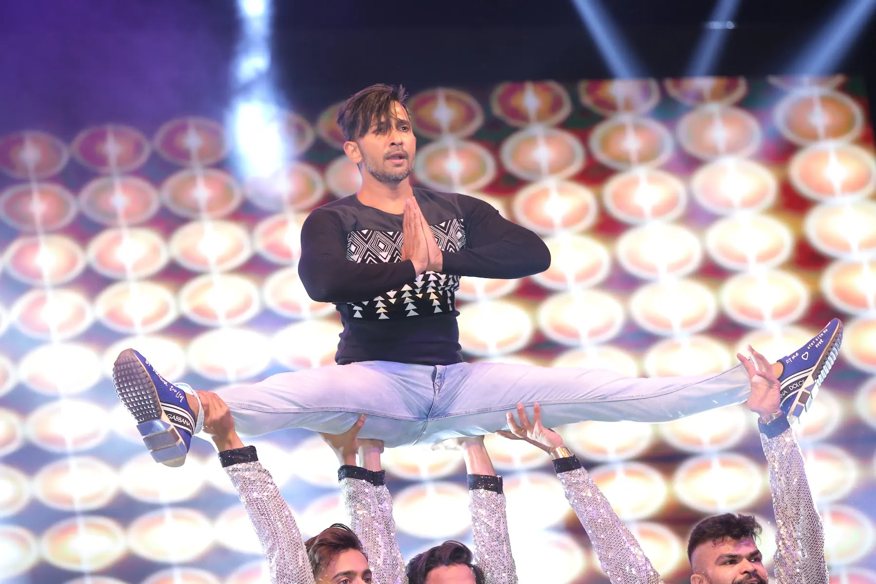 Performer lifted by dancers on stage at the Flipkart celebration night