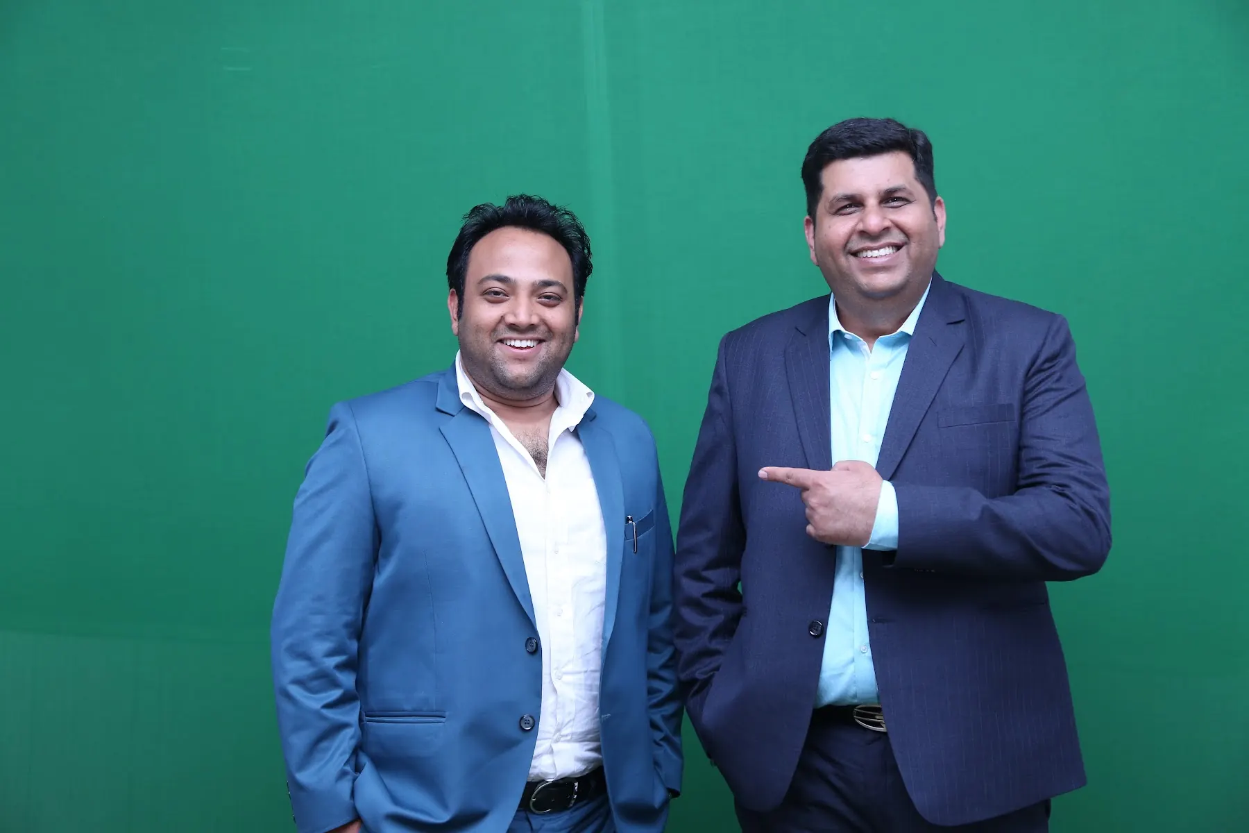 Two executives at a green screen shoot