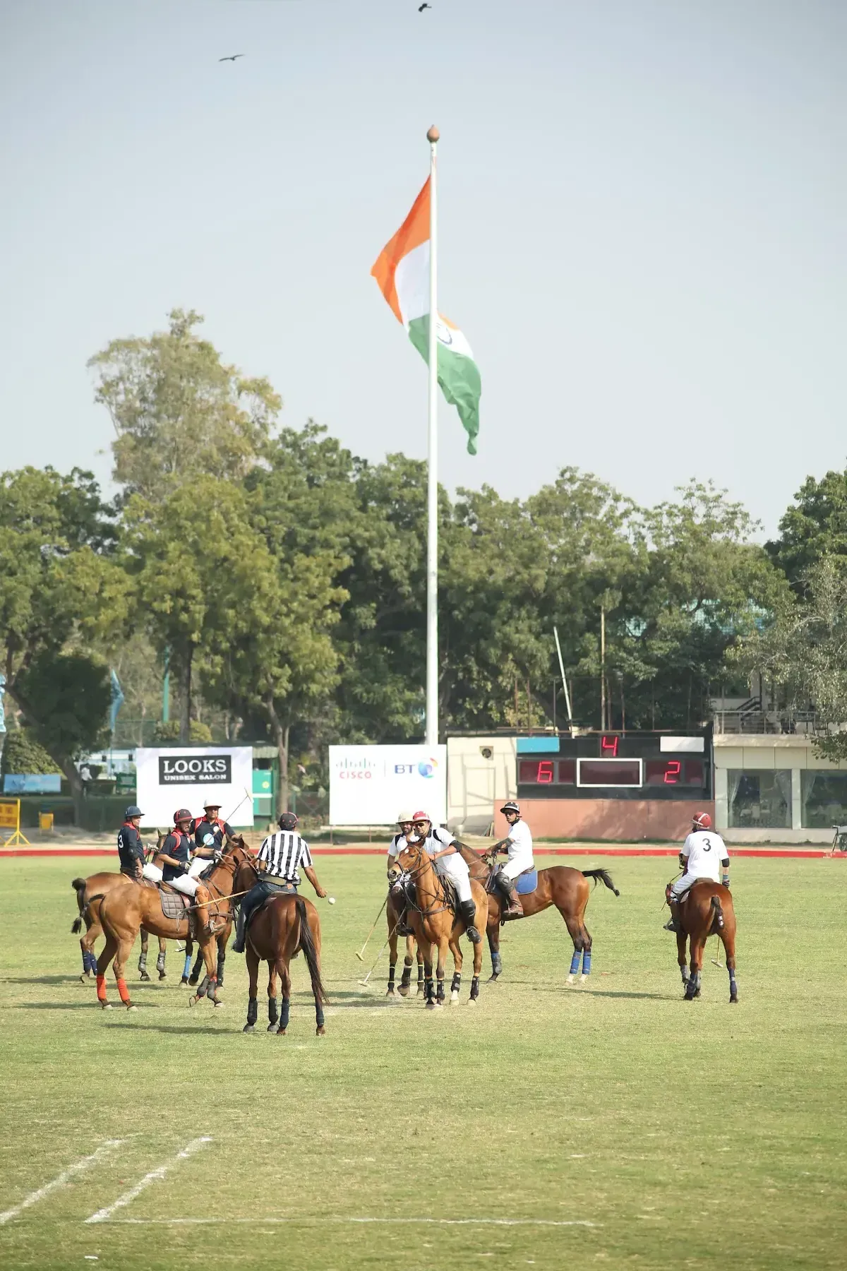 Polo match with the Indian flag in the background