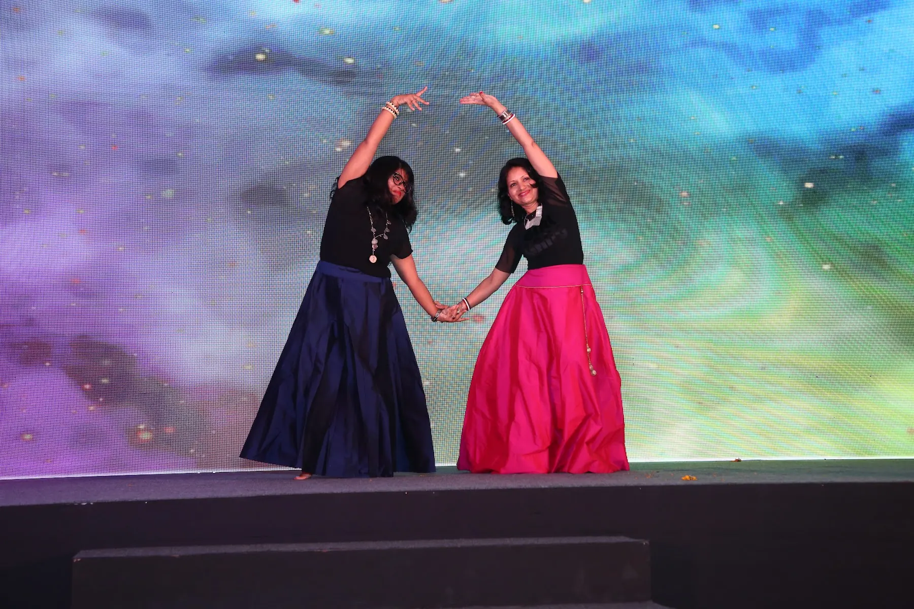 Dancers performing on a corporate stage